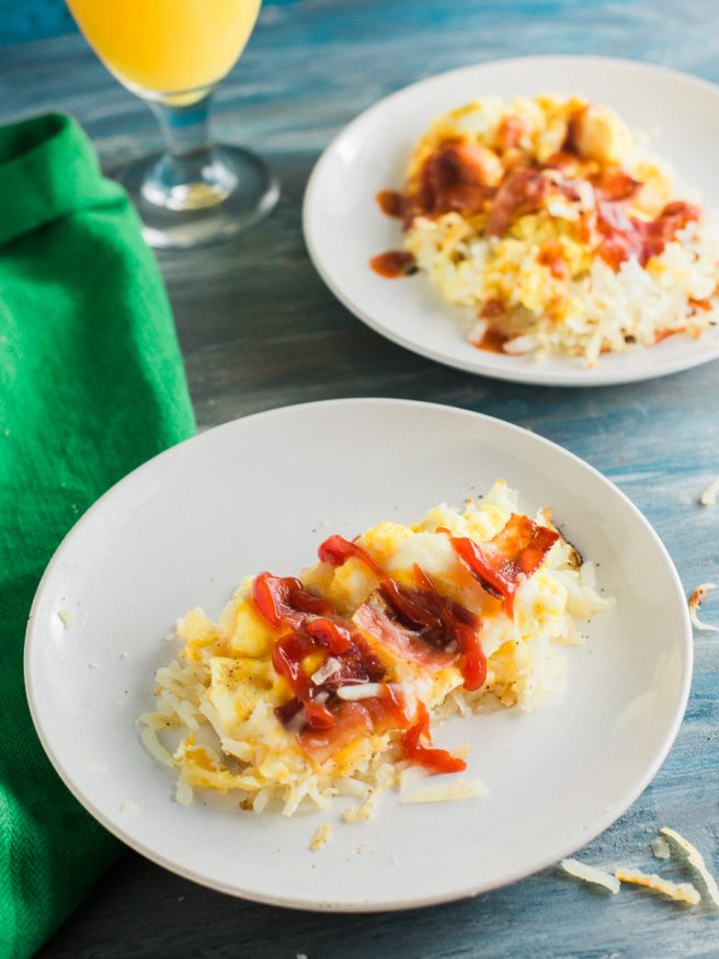 Hashbrown Breakfast pizza with a hash brown crust, topped with scrambled eggs, cheese and bacon. Such a great Saturday morning breakfast!