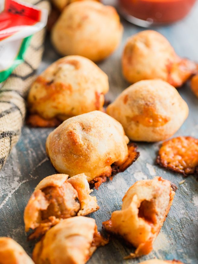 Meatball Marinara Bombs with pre-cooked Italian meatballs, pizza dough, mozzarella cheese and marinara sauce. Super fun snack idea, great for watch parties!