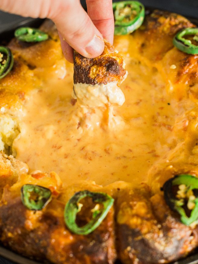Turning your house into a Rotel Famous Queso house is ridiculously easy, with this pretzel ring skillet recipe making it the perfect one-pan dip!