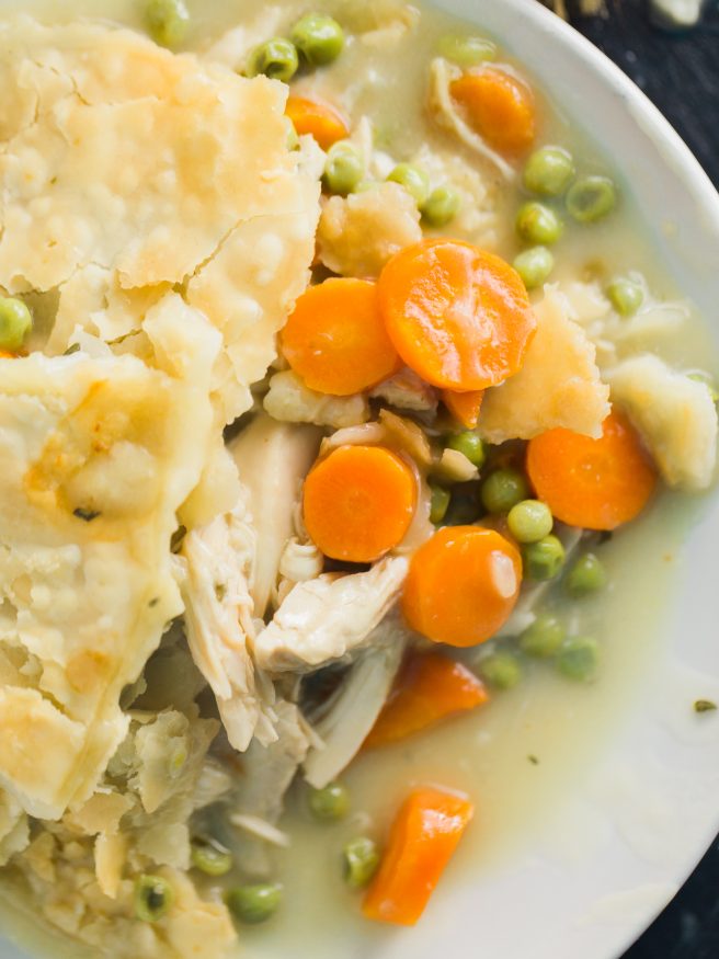 Chicken Pot Pie that's easy to prep. All in one skillet with pre-cooked rotisserie chicken, fresh rosemary, thyme peas and carrots! 
