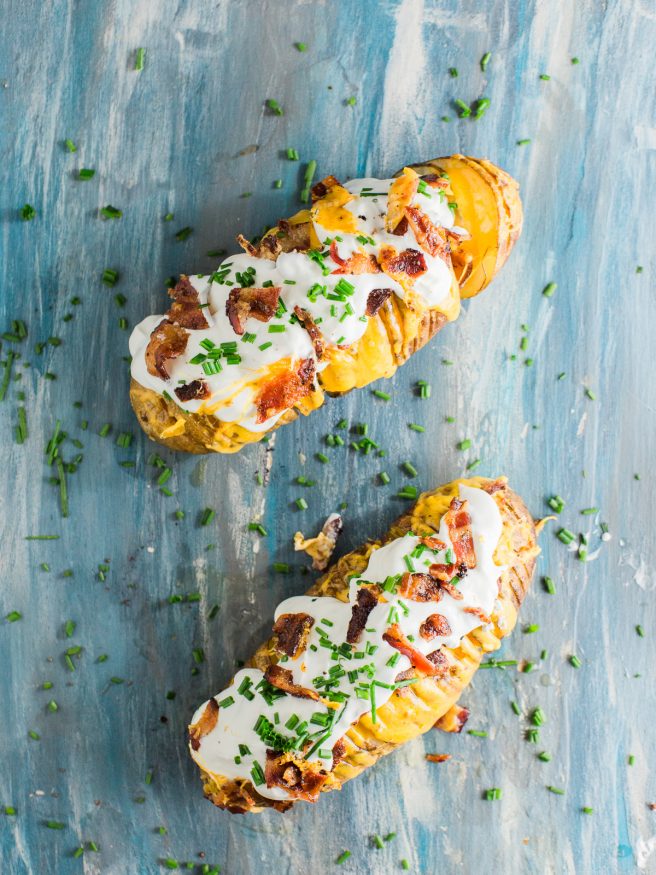 Hasselback potatoes loaded with cheese, bacon, sour cream, and fresh chopped chives, this is my new favorite way to have a baked potato!