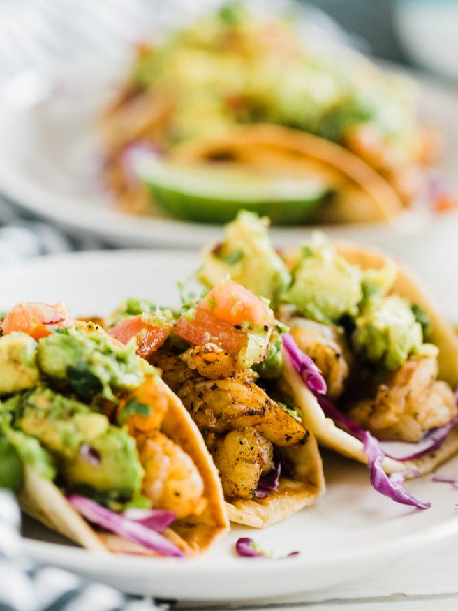 Spicy Shrimp Tacos cooked on the grill, with chili powder, red pepper flakes, cayenne pepper, and other spices. Perfect for the summer!