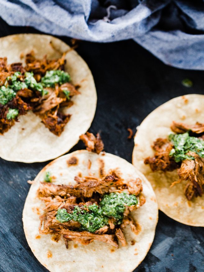 Grilled barbacoa tacos, cooked low and slow with a zesty chimichurri sauce. Barbacoa makes an excellent change to taco Tuesday! dadwithapan.com