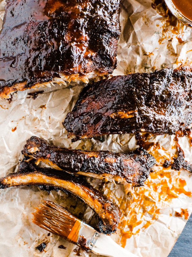 Slow grilled baby back ribs with a sweet and spicy barbecue rub. Grilled with a smoker box full of apple wood chips and super tender and delicious!