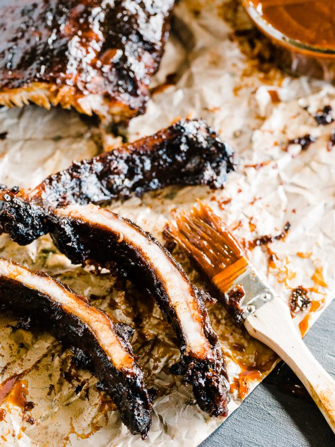 Slow grilled baby back ribs with a sweet and spicy barbecue rub. Grilled with a smoker box full of apple wood chips and super tender and delicious!