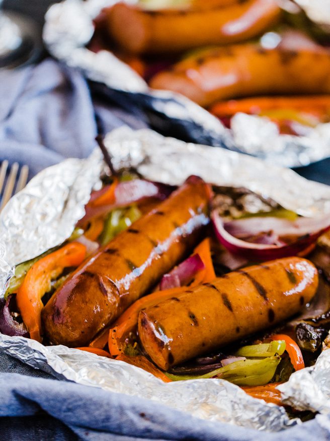 Sausage and Peppers done in foil packs making cooking, prep, and cleanup a breeze. Perfect for summer weeknights!