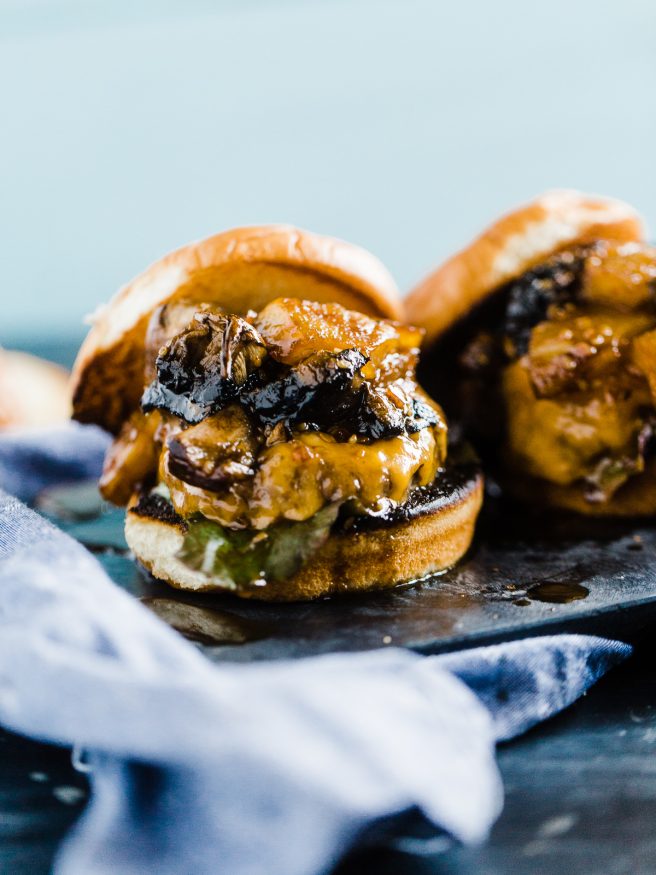 Teriyaki Burger topped with a Grilled pineapple, portabella mushroom, simmering in teriyaki sauce and topped on toasted Hawaiian hamburger rolls. 