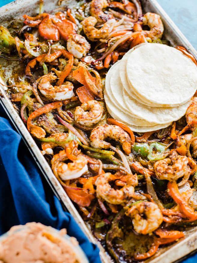 Spicy Shrimp fajitas with a homemade fajita seasoning. Cooked all on one sheet pan making this meal amazingly easy to prepare and cook!