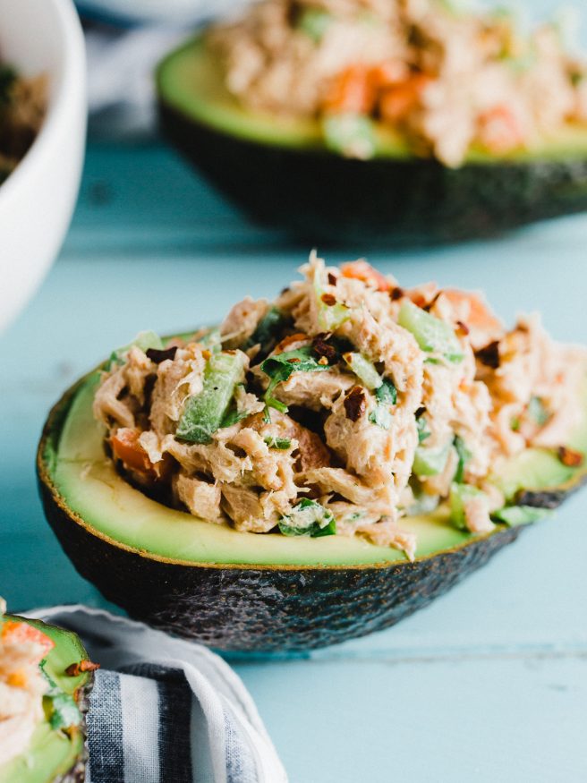 Tuna Salad Avocado Boat with a red pepper flakes to add some heat. Fresh vegetables with a little Dijon mustard and mayonnaise mixed with tuna. Delicious!