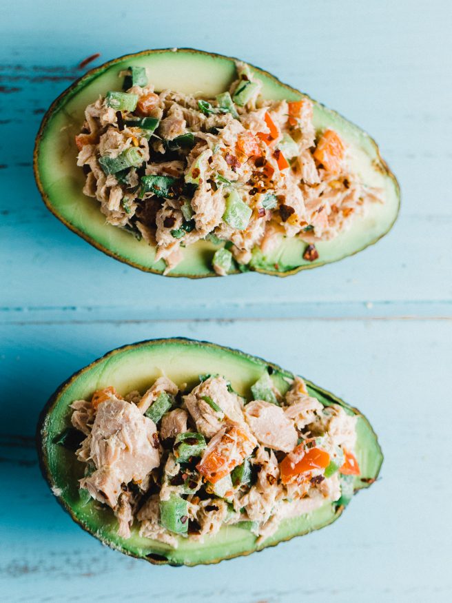 Tuna Salad Avocado Boat with a red pepper flakes to add some heat. Fresh vegetables with a little Dijon mustard and mayonnaise mixed with tuna. Delicious!