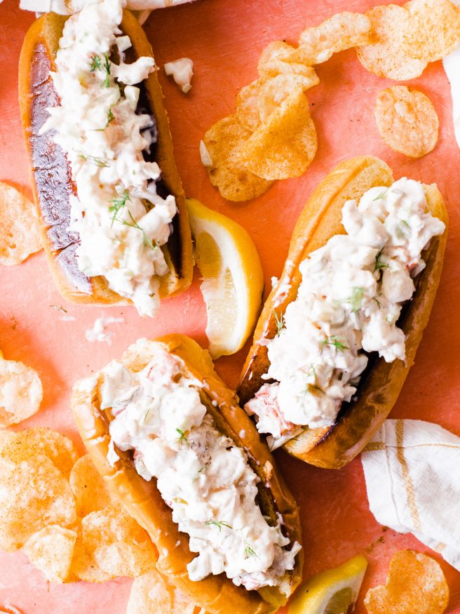 Smoked lobster roll with old bay seasoned chips is the best way to enjoy the summer! Smoked  lobster on a traeger grill and loaded on toasted brioche buns. 