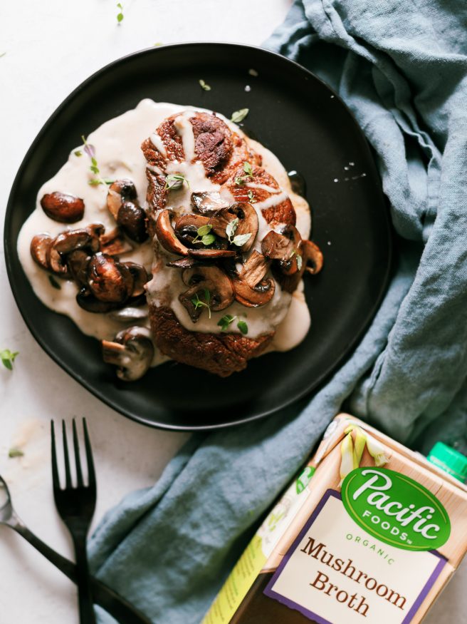 Pan seared filet mignon with a from scratch mushroom cream sauce pour on top. Served with sauteed mushrooms making for an amazing dinner!