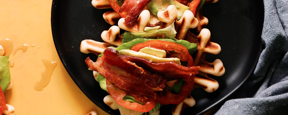 BLT Waffles bites combine the best of both worlds. Smothered with maple syrup to make this an awesome way to enjoy your next game day!