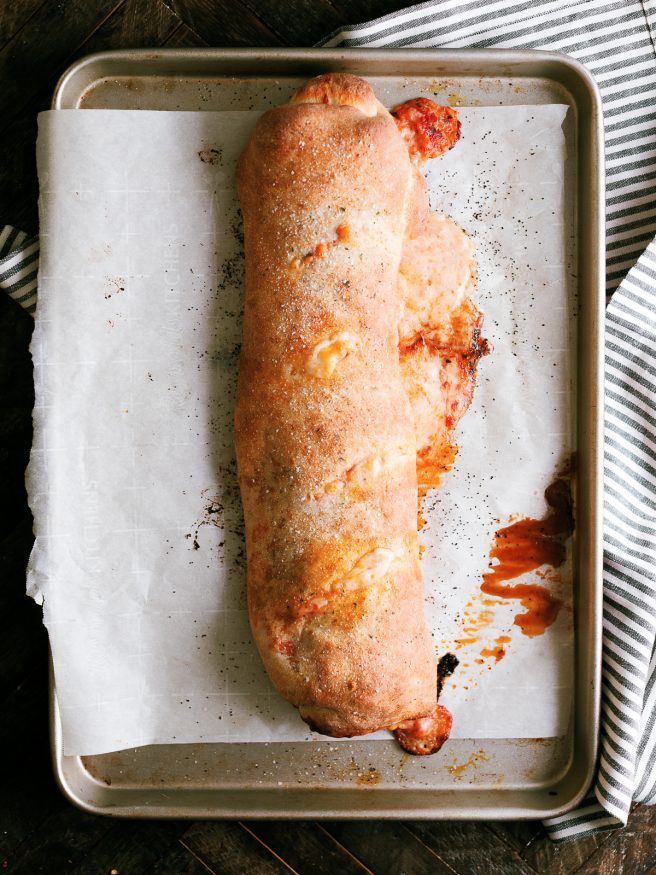 Easy to make Stromboli, loaded with pepperoni, mushroom and cheese, layered so that everyone has their favorite toppings in their own slice!