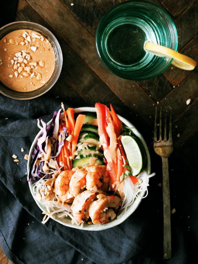This spring roll bowl has grilled shrimp, rice stick noodles, and fresh veggies topped with a peanut sauce. Much easier to make than actual spring rolls!