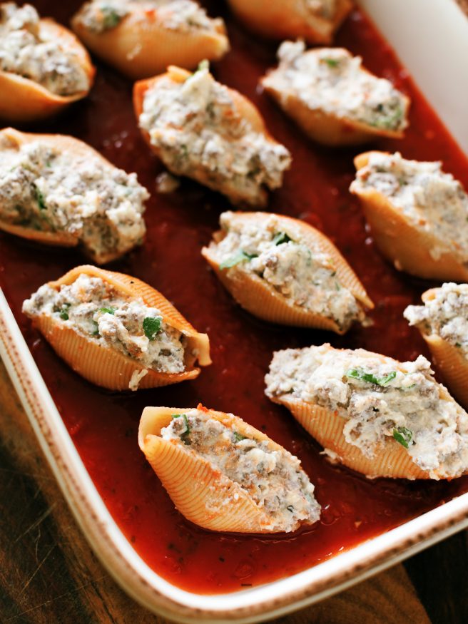 Lasagna stuffed shells with ground beef, ricotta and Italian seasonings, topped with mozzarella and can be made ahead of time!