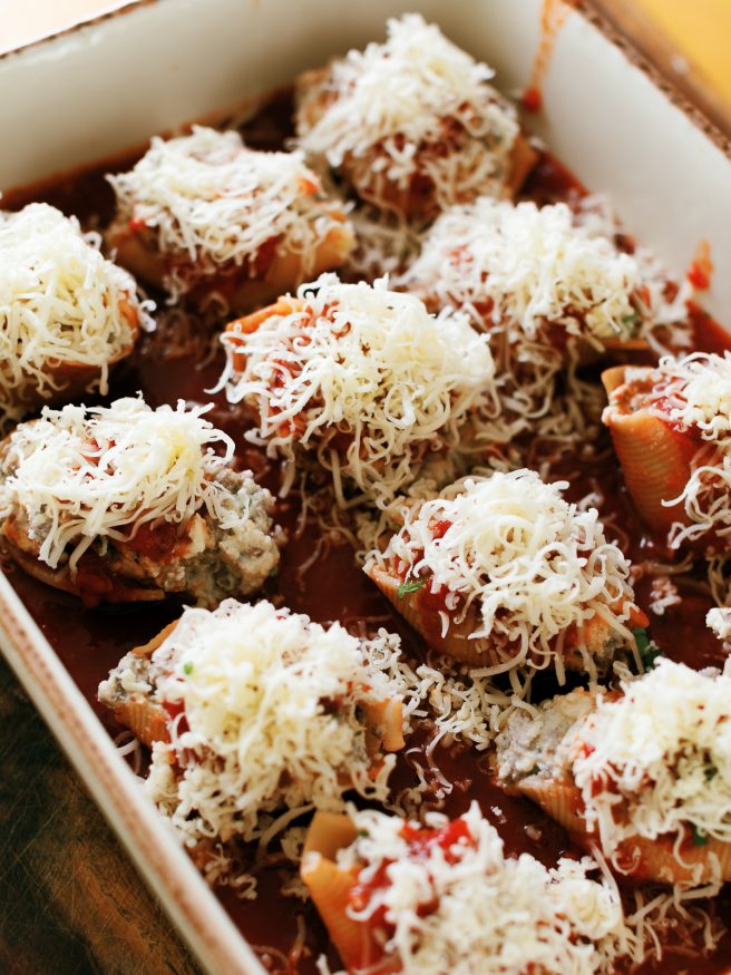 Lasagna stuffed shells with ground beef, ricotta and Italian seasonings, topped with mozzarella and can be made ahead of time!