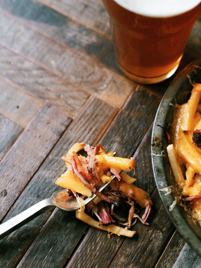 Leftover Smoked pulled pork gets a second life with this pulled pork cheese fries recipe. Its smokey, cheesy, and slathered with BBQ sauce on top of fries. What isn't there to like?!
