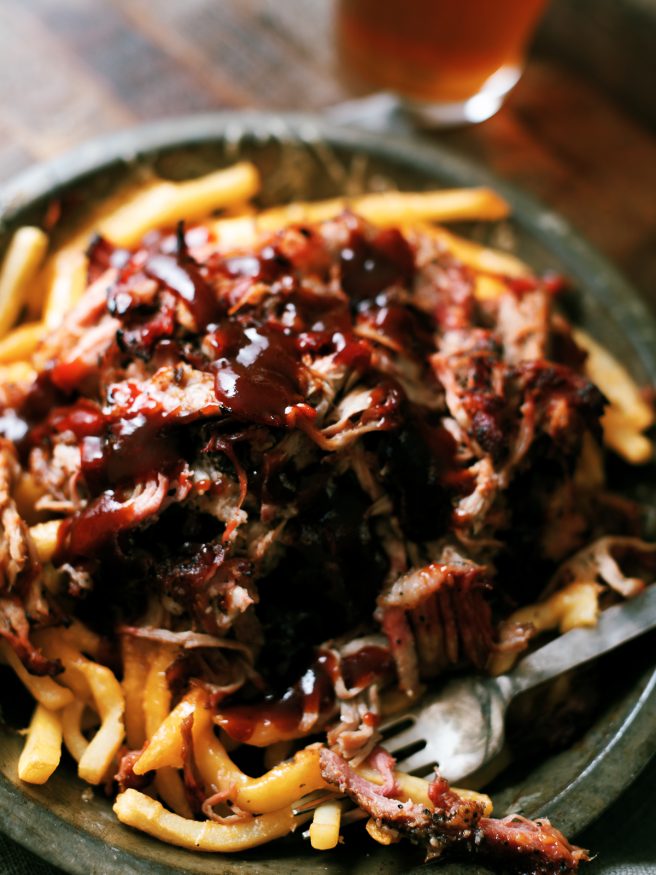 Leftover Smoked pulled pork gets a second life with this pulled pork cheese fries recipe. Its smokey, cheesy, and slathered with BBQ sauce on top of fries. What isn't there to like?!
