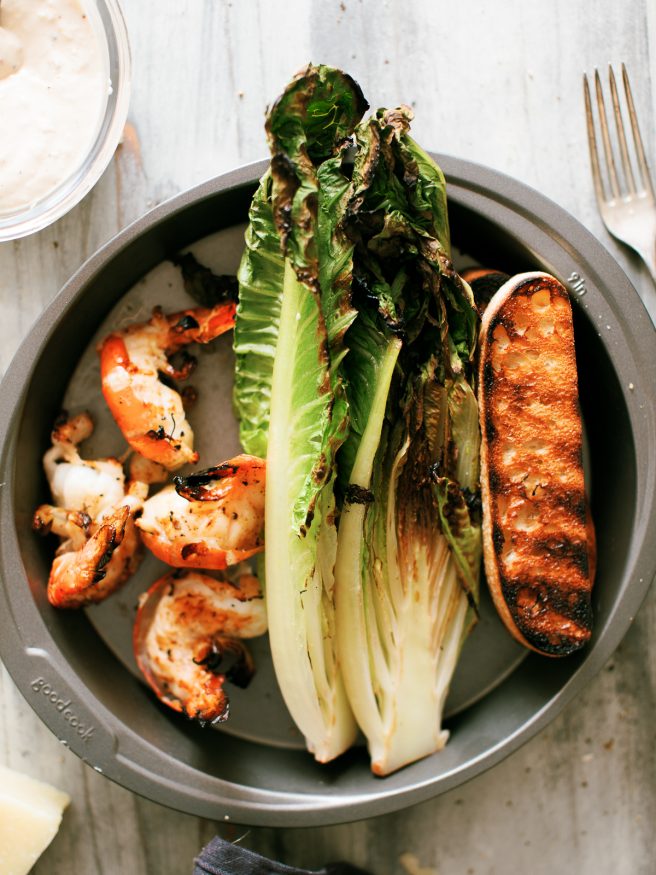 Grilled Caesar Salad, with grilled shrimp, grilled croutons, grilled romaine lettuce. The only thing that isn't grilled is the from scratch Caesar dressing!
