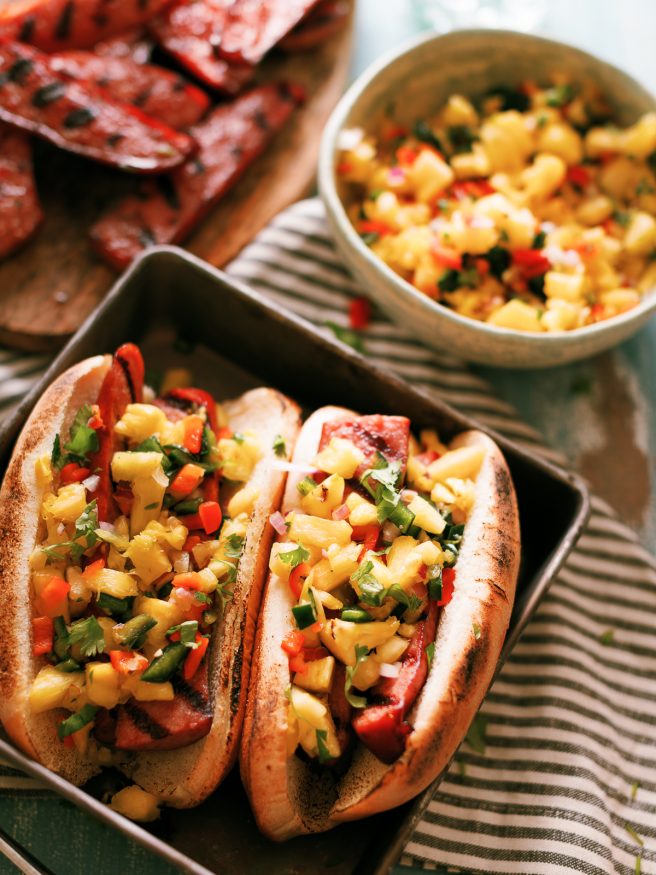 The smokiness from the sausage and bright, beautiful flavors from the pineapple
salsa go together perfectly in this awesome summer grilled sausage hoagie!
