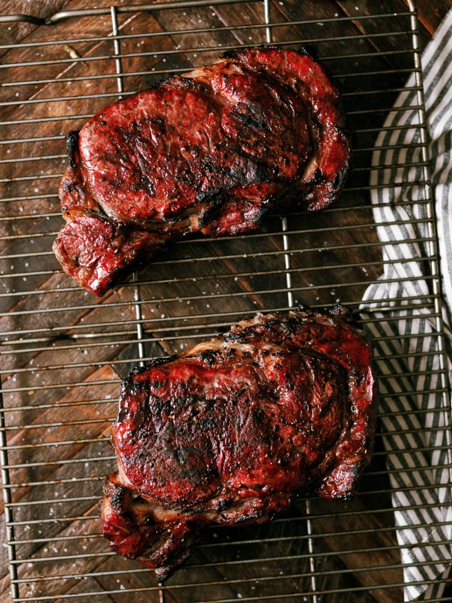 Smoked rib eye steaks with hickory pellets on a Traeger, then cold grate seared on my Weber Kettle, to get the perfect crust and flavor on any steak!