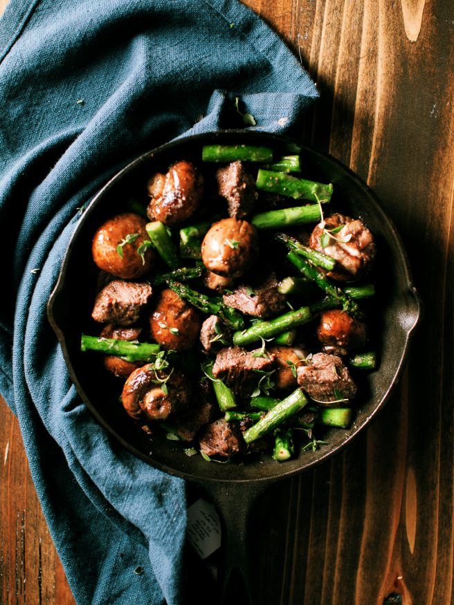 Steak and mushroom bites with filet mignon, baby portabello and asparagus. Seared in a cast iron skillet with butter, herbs and garlic. 