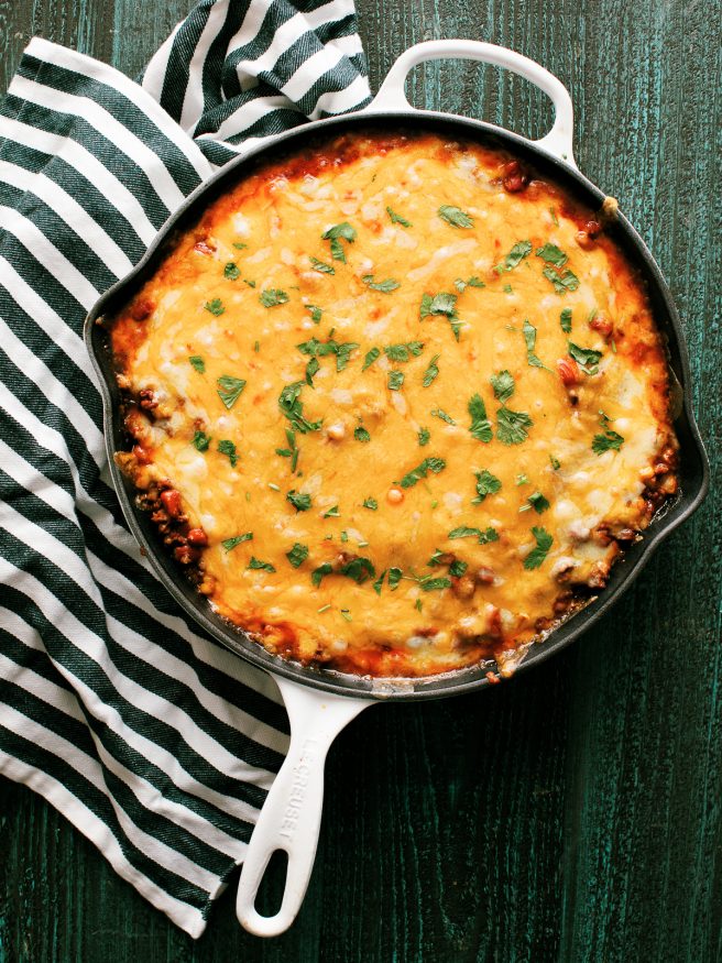 Tamale Pie is perfect comfort food! Ground beef beans,fire roasted corn with a taco seasoning, on top of cornbread and loaded with cheese.