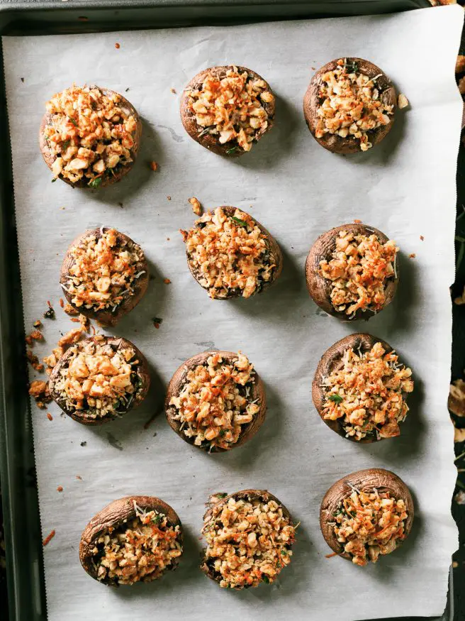 These walnut and rosemary stuffed mushrooms are the perfect appetizer to put together for the holidays. Comes together in 15 minutes!