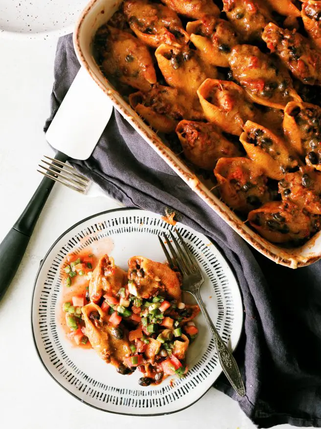 These taco stuffed shells with ground beef taco filling are worth having on the dinner table when you want to change up taco night or pasta night. 