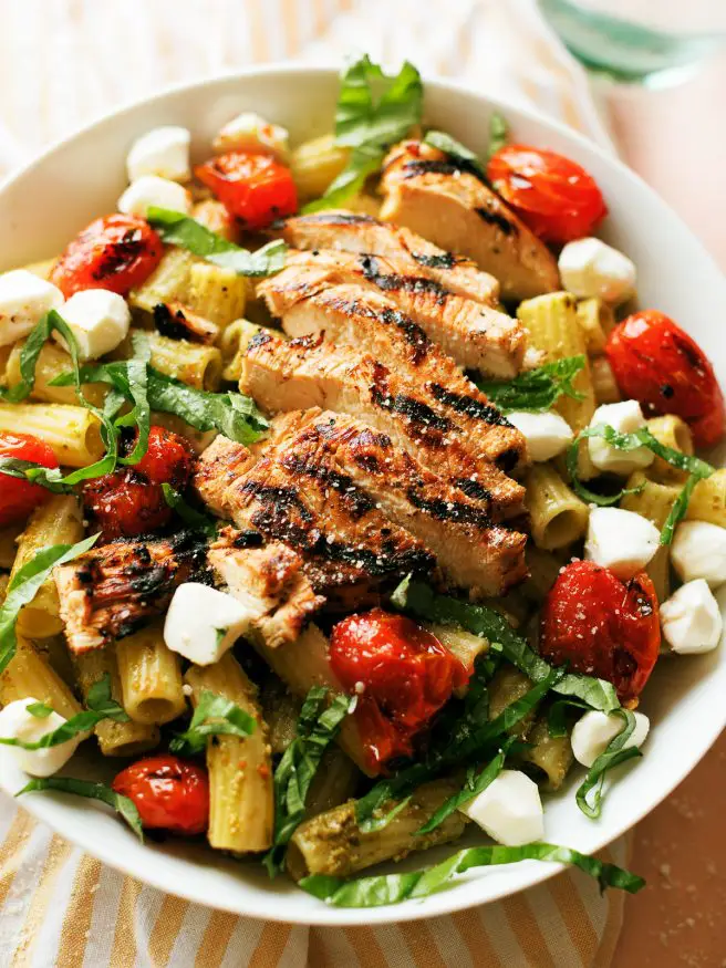 Grilled Chicken Caprese Pasta with a basil pesto and quick balsamic vinaigrette glazed chicken breast makes a quick dinner that can be done in 30 minutes. 