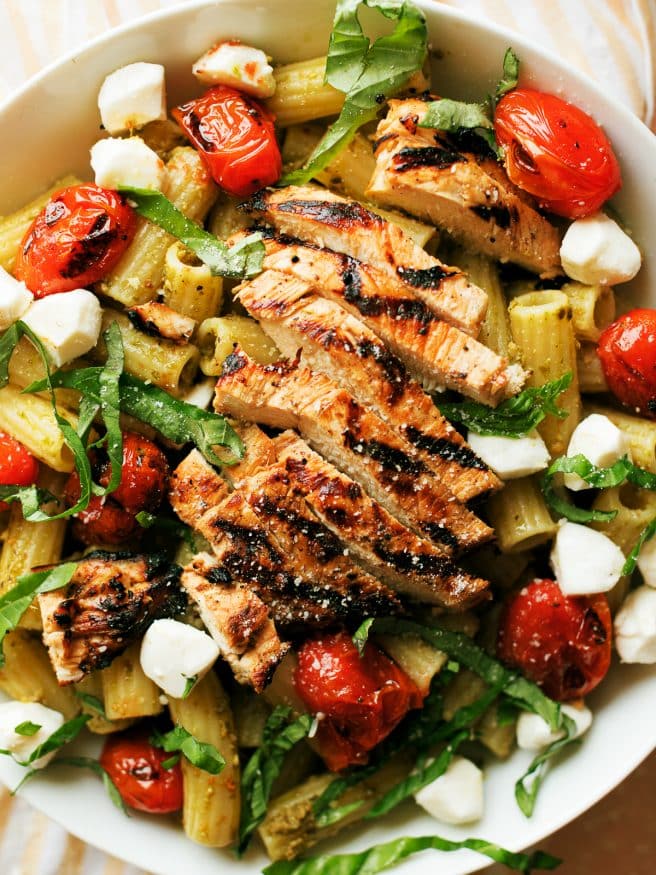 Grilled Chicken Caprese Pasta with a basil pesto and quick balsamic vinaigrette glazed chicken breast makes a quick dinner that can be done in 30 minutes. 