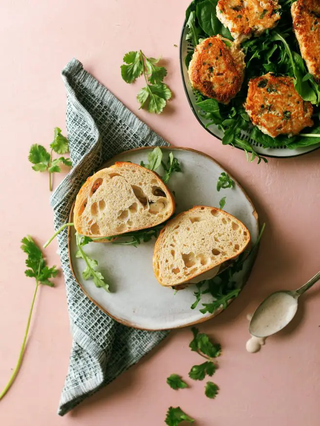 Tuna Fish Cake Sandwich packed with green onion, water chestnuts, jalapeno and topped off with an Old Bay Aioli that is amazing! 