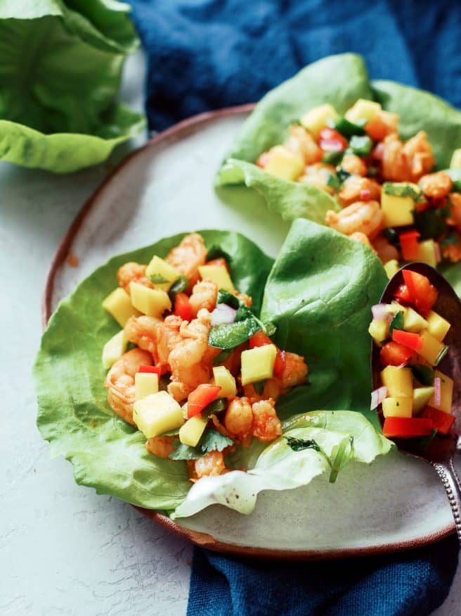 Margarita shrimp for lettuce wraps served up with a beautiful mango salsa. This is an amazing lunch or dinner!