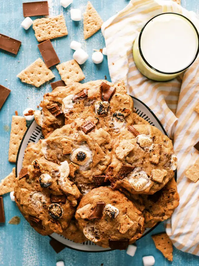 These smoked s'mores cookies are next level. They're s'mores combined with a chocolate chip cookie on a pellet grill to get a beautiful smokey flavor! 