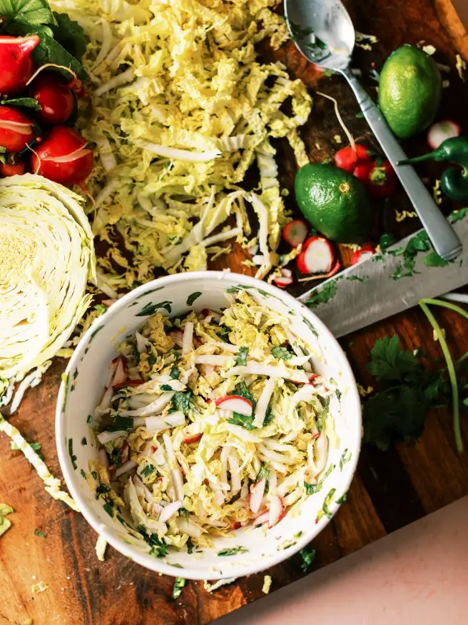 Cilantro lime lobster tacos with a zesty and spicy slaw mad with napa cabbage, cilantro, lime and serrano peppers. 