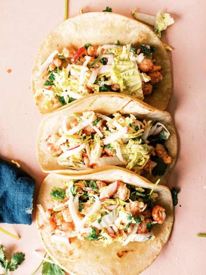 Cilantro lime lobster tacos with a zesty and spicy slaw mad with napa cabbage, cilantro, lime and serrano peppers. 