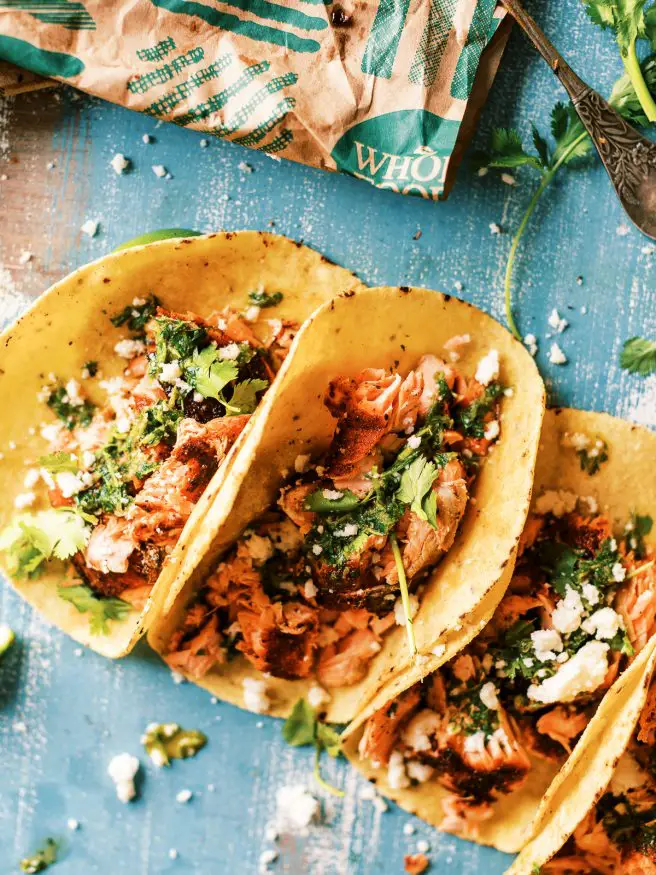 Grilled blackened salmon tacos using Sockeye Salmon rubbed with a simple blackened seasoning. Topped with a spicy chimichurri will make amazing fish tacos!