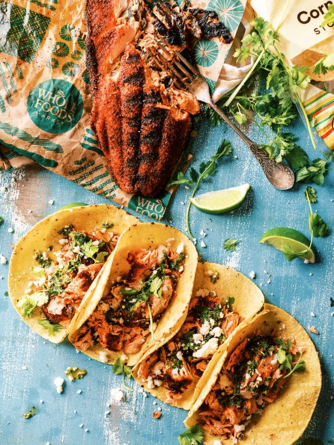 Grilled blackened salmon tacos using Sockeye Salmon rubbed with a simple blackened seasoning. Topped with a spicy chimichurri will make amazing fish tacos!