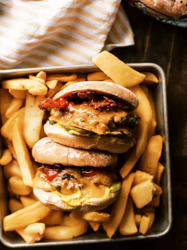 Smash burgers lightly seasoned, and smashed into a hot griddle, until they're perfectly browned. There's no other way to make a cheeseburger