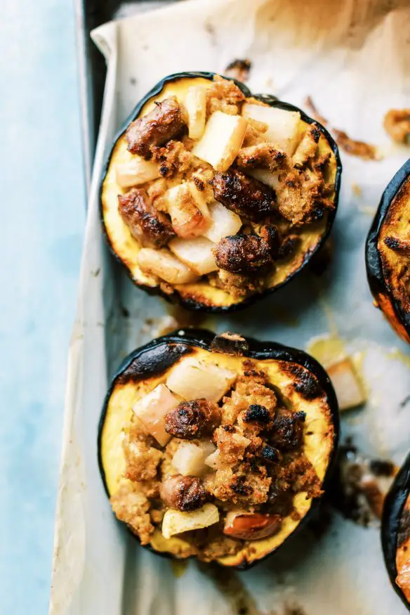 Breakfast Stuffing Acorn Squash loaded with maple sausage, pears and apples, and with a sweet maply syrup infused stuffing. 