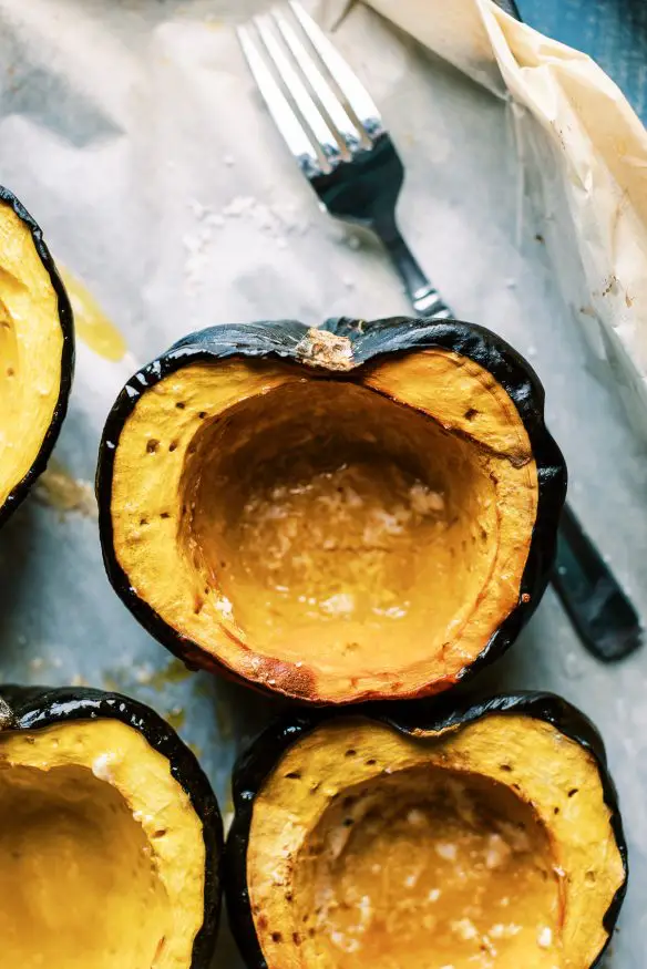 Breakfast Stuffing Acorn Squash loaded with maple sausage, pears and apples, and with a sweet maply syrup infused stuffing. 