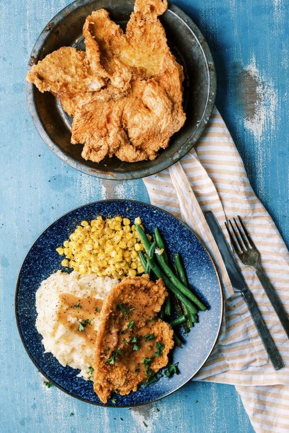 country fried chicken in a seasoned breading that is perfect for a homestyle comfort meal. Thin chicken fried until crispy and golden!