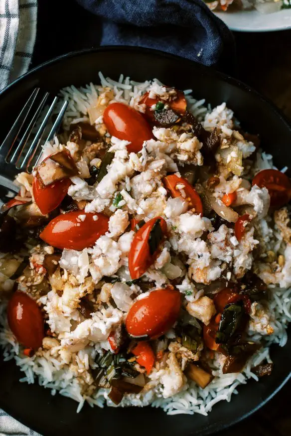 Shrimp Kelaguen is a Chamorro recipe that is similar to ceviche. The shrimp is cooked in the acid of lemon juice and with coconut peppers and onion. 