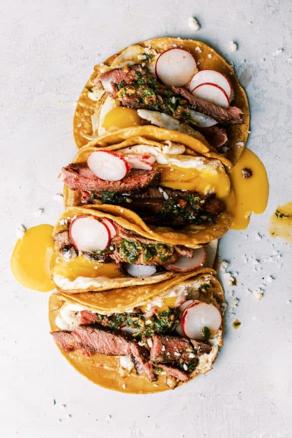 Steak and Egg Breakfast Tacos topped with some chimichurri and a little queso fresco and you've got a amazing twist on a breakfast classic!