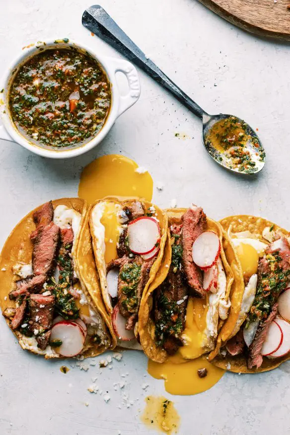 Steak and Egg Breakfast Tacos topped with some chimichurri and a little queso fresco and you've got a amazing twist on a breakfast classic!