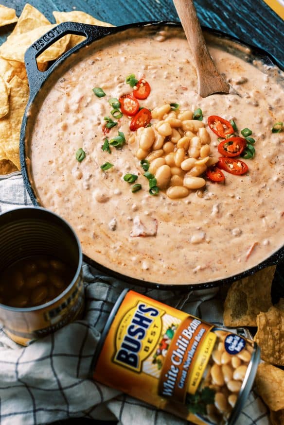 This white bean queso dip is loaded with all sorts of goodness. White Chili Beans , ground beef and all sorts of cheese. It’s got tailgating vibes all over it!  