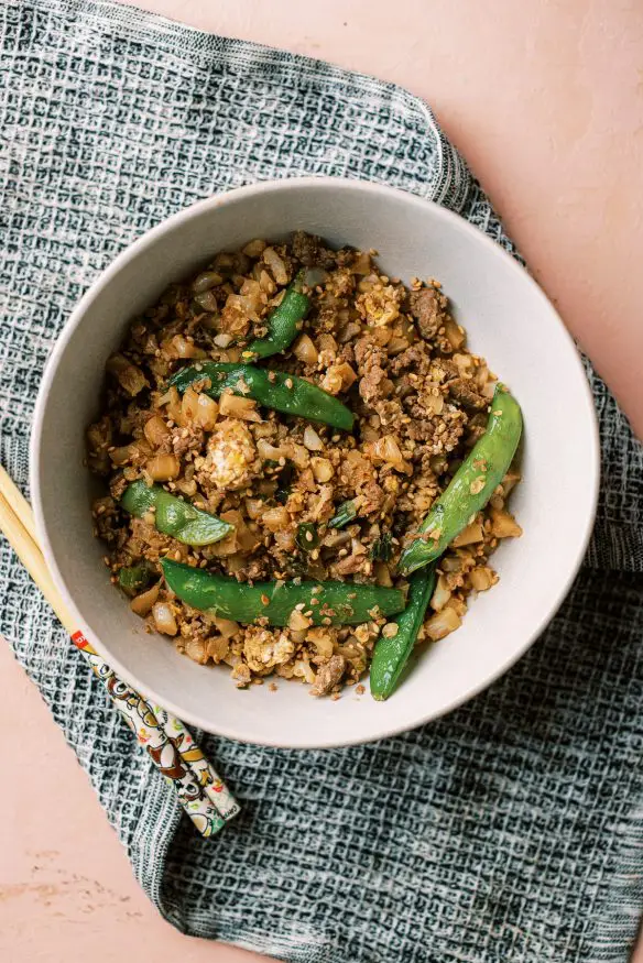 Cauliflower fried rice with beef is a great low carb, high protein keto friendly meal that will get your fried rice fix in!