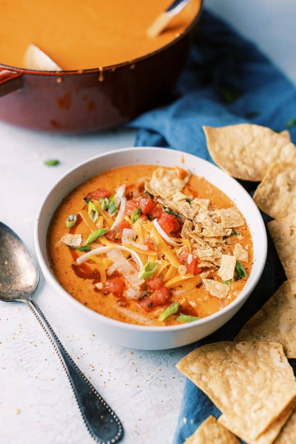 Chicken Enchilada Soup is cheesy, hearty and quite addicting. You can add rotisserie chicken in at the end to make this a quick weekend soup!