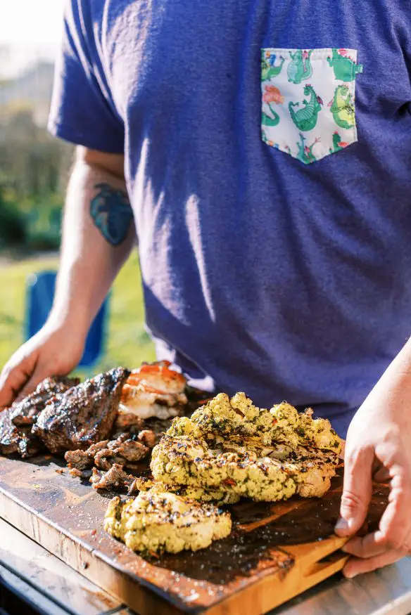 grilled chimichurri cauliflower with a quick chimichurri sauce, marinated cauliflower, then grilled. Perfect keto side!